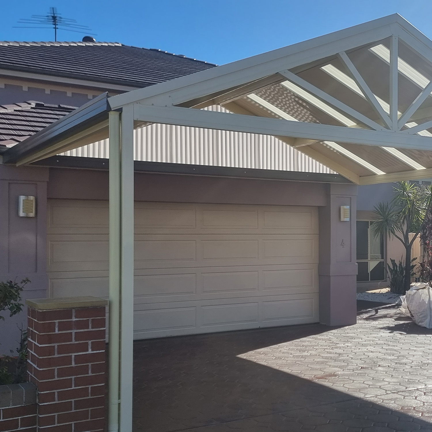 Modern house with diy freestanding gable roof carport kits