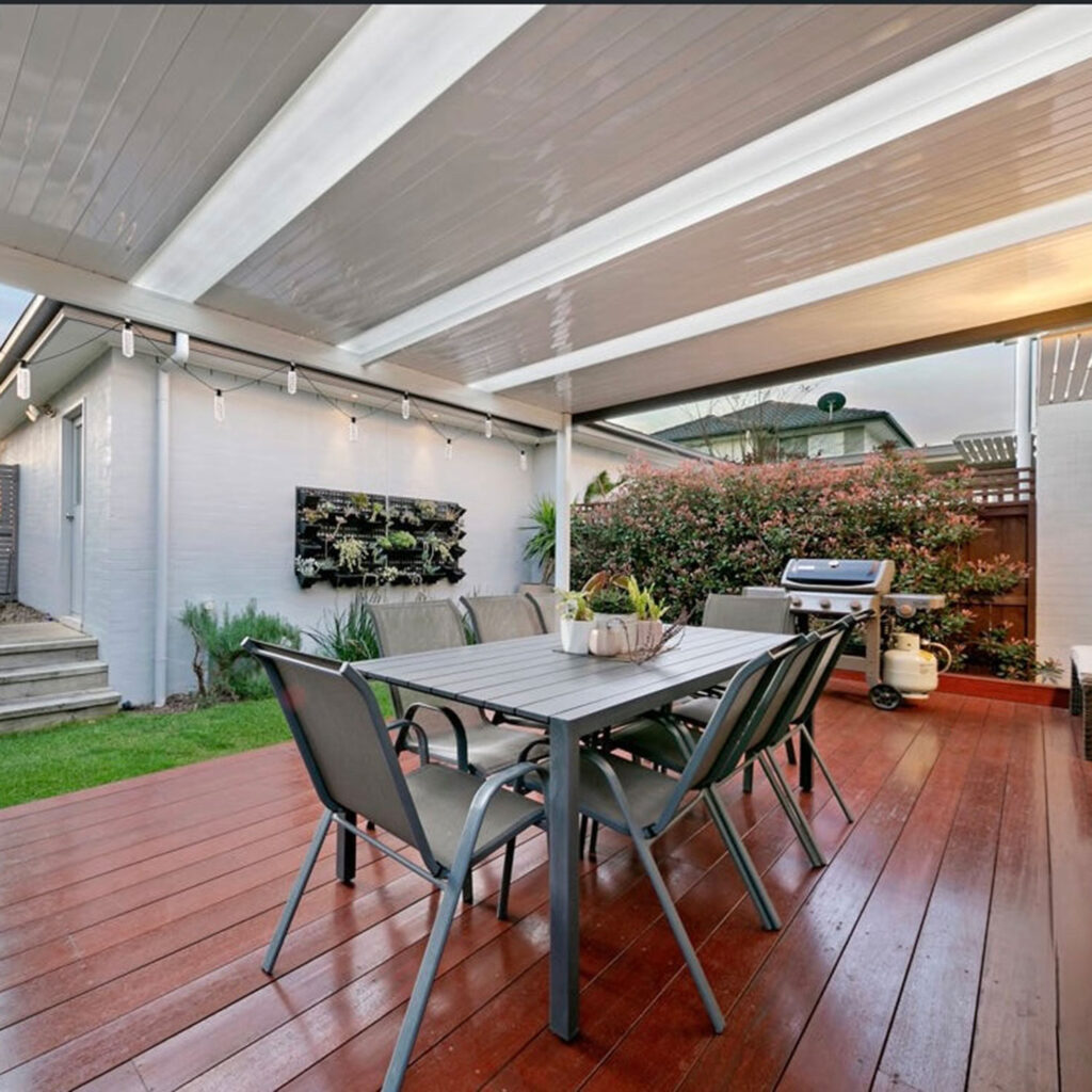 DIY attached flat roof pergola/patio with dining table and BBQ grill