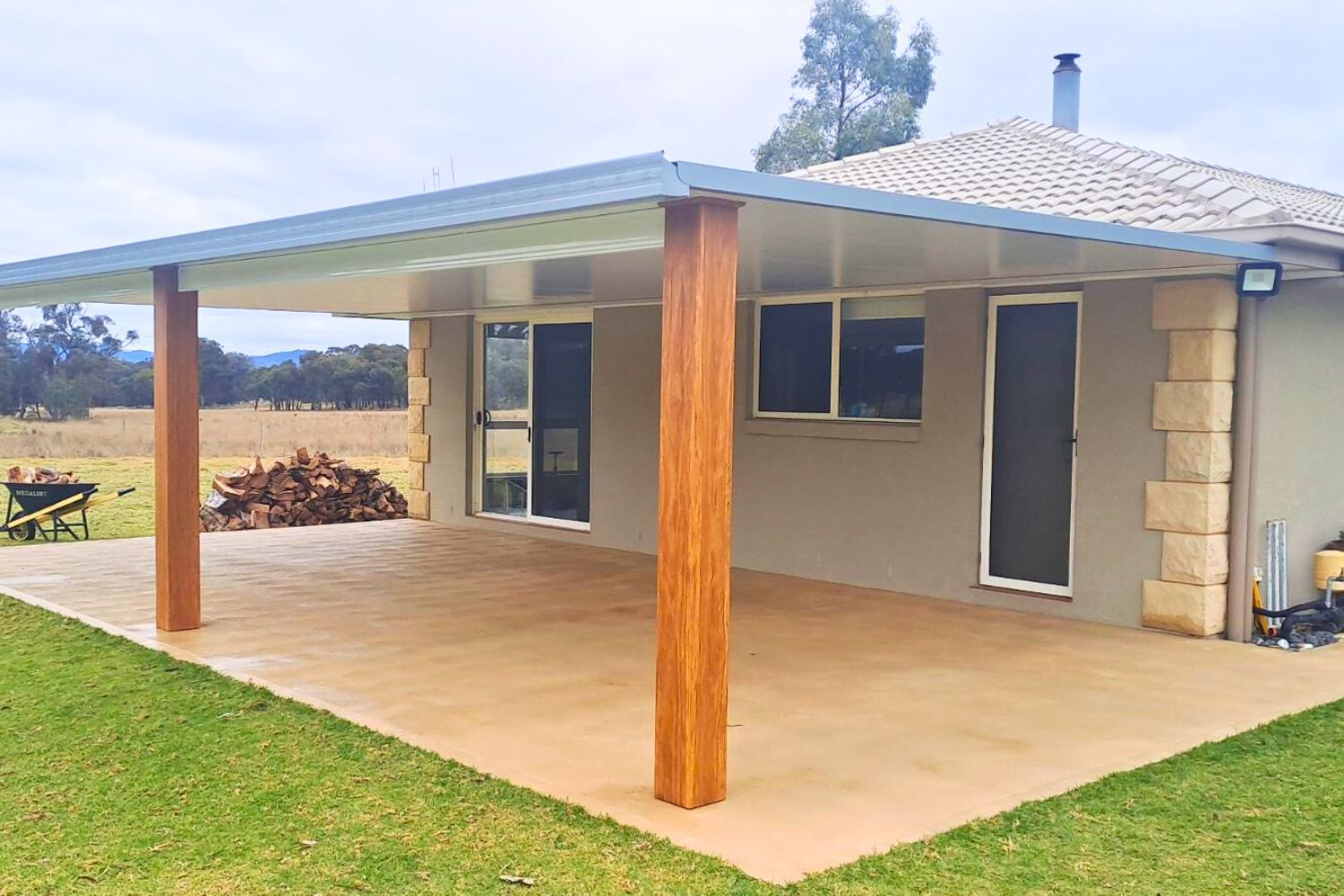 Modern outdoor patio with garden view.