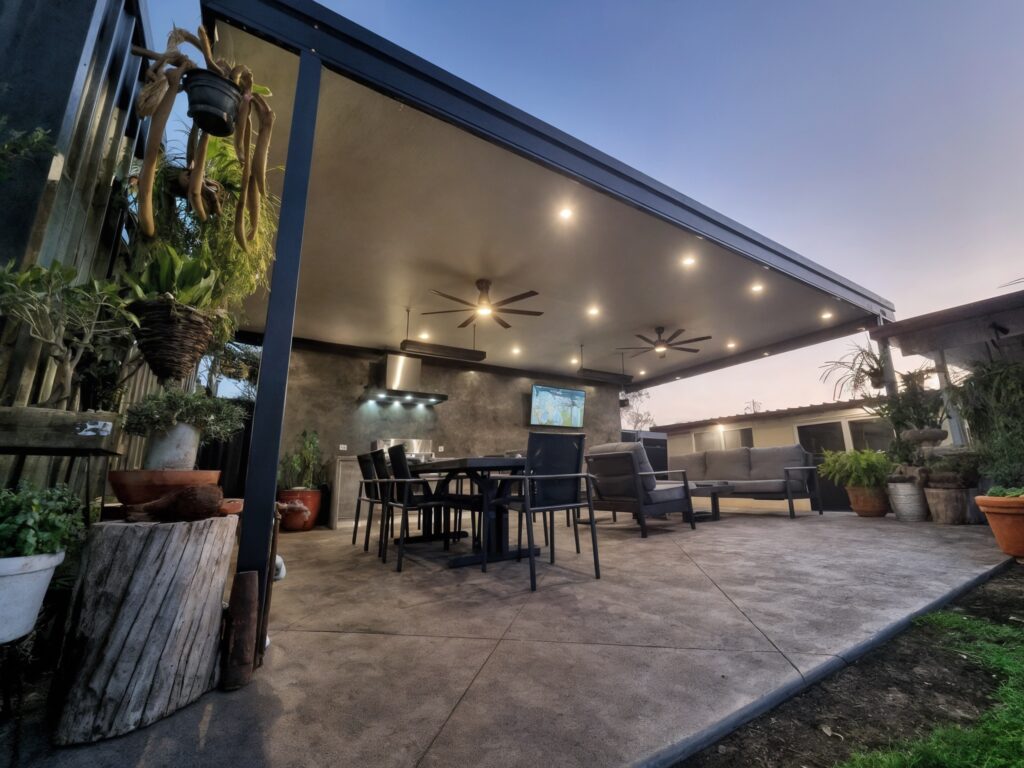 Stylish outdoor patio with plants and seating area.